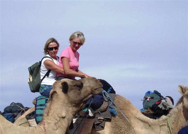 Two trekers take the camel taxi - bet they both got the hump